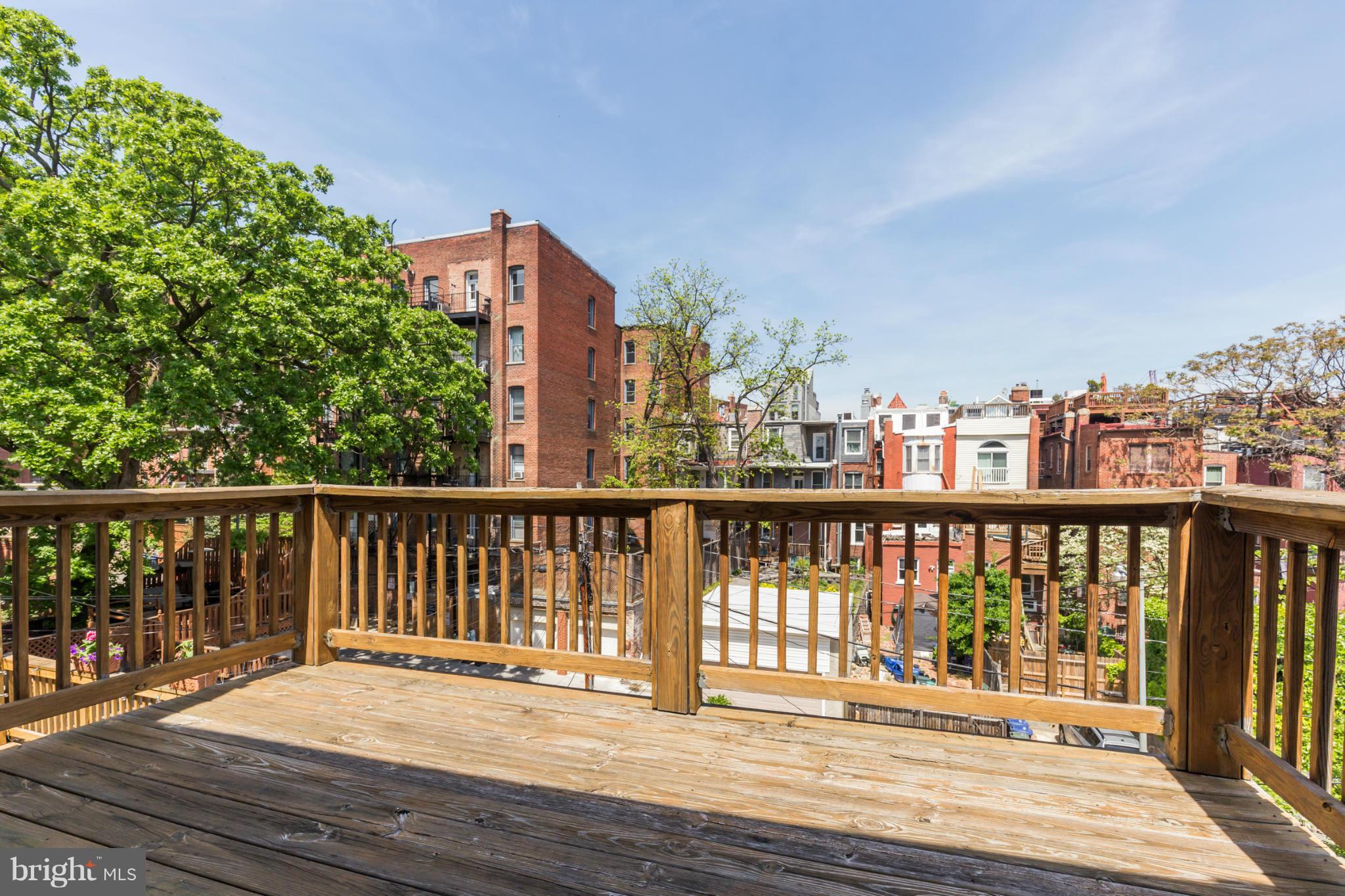 1823 Kalorama Road Northwest Washington, DC 20009 - Photo 13 of 20 a view of balcony with wooden floor and fence