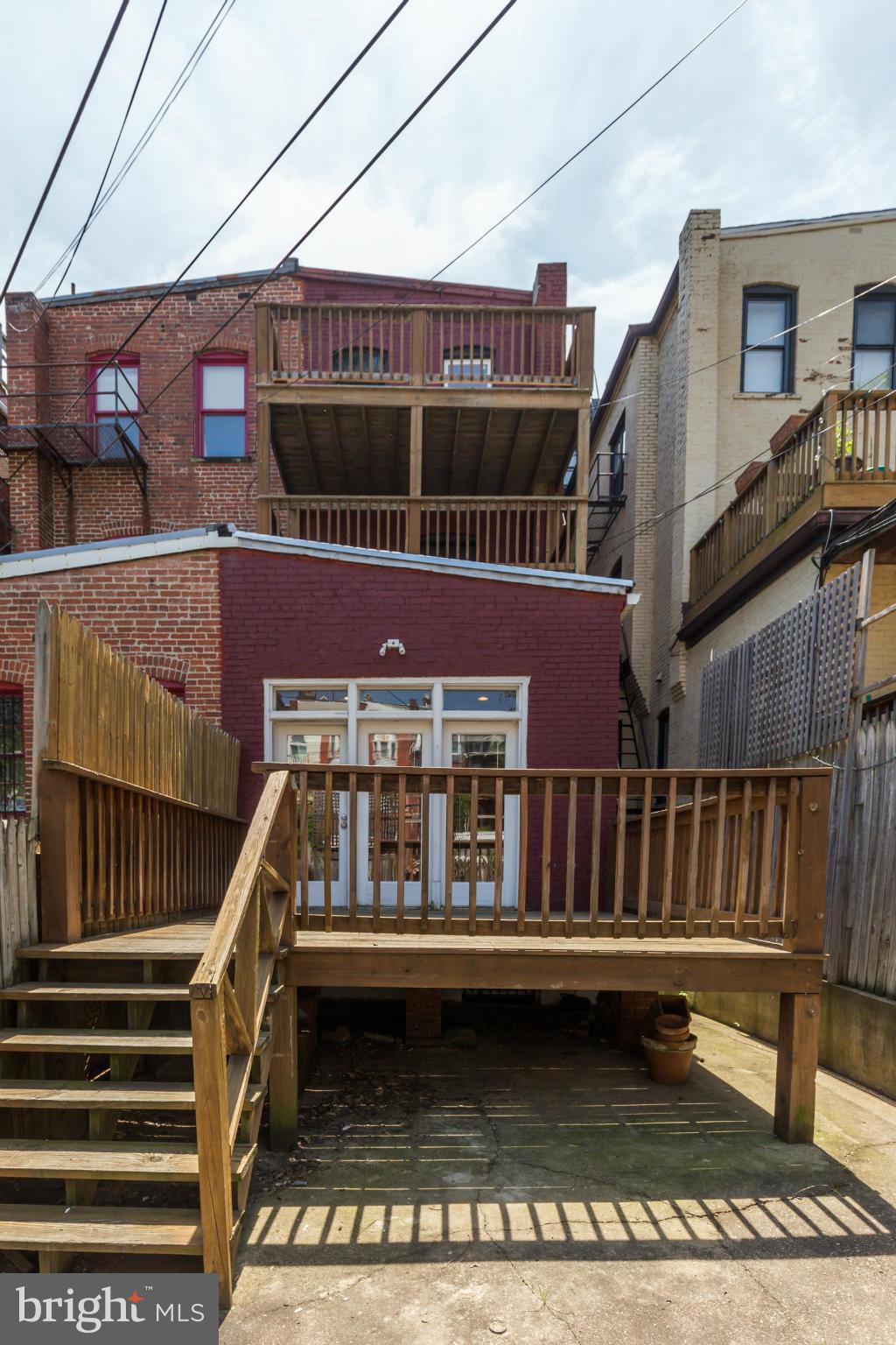 1823 Kalorama Road Northwest Washington, DC 20009 - Photo 19 of 20 a view of a house with wooden deck