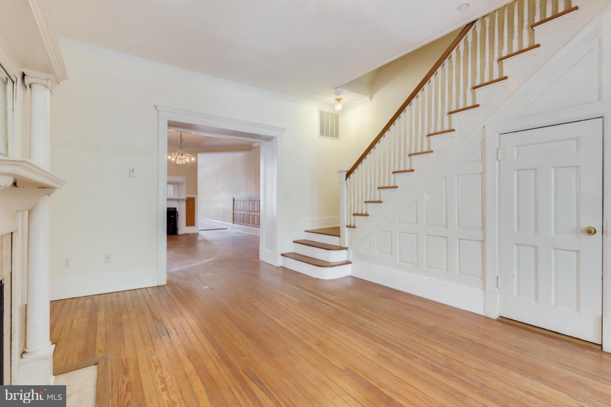 1823 Kalorama Road Northwest Washington, DC 20009 - Photo 3 of 20 a view of a hallway view with wooden floor and staircase