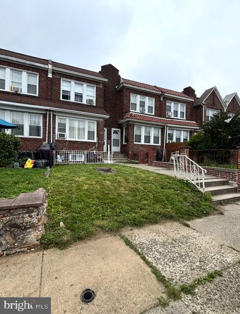 1422 Fanshawe Street Philadelphia, PA 19111 - Photo 1 of 12 a view of a yard in front of a brick house with a yard