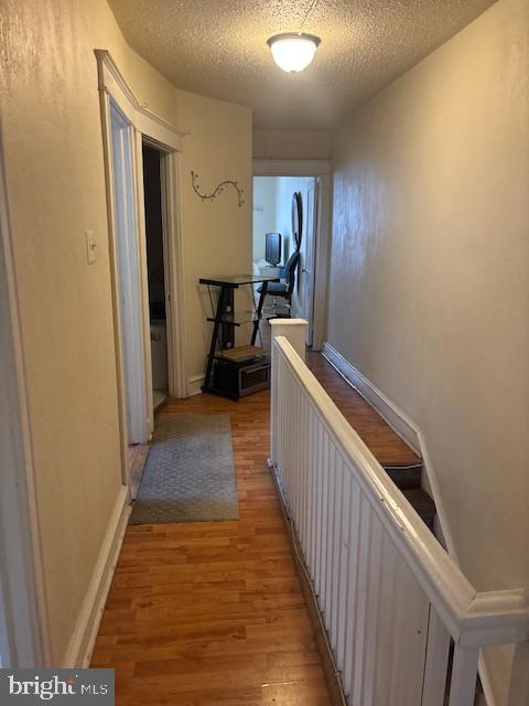 1422 Fanshawe Street Philadelphia, PA 19111 - Photo 11 of 12 a view of a hallway with wooden floor and furniture