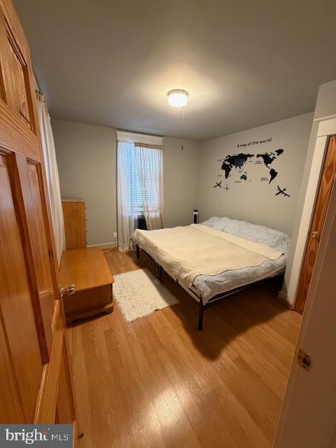 1422 Fanshawe Street Philadelphia, PA 19111 - Photo 5 of 12 a bedroom with a bed and wooden floor