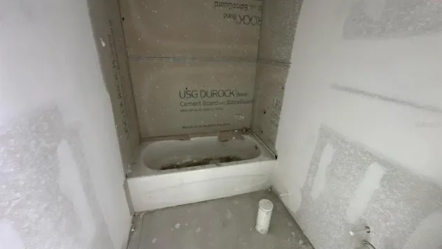 a bathroom with a toilet and a bathtub