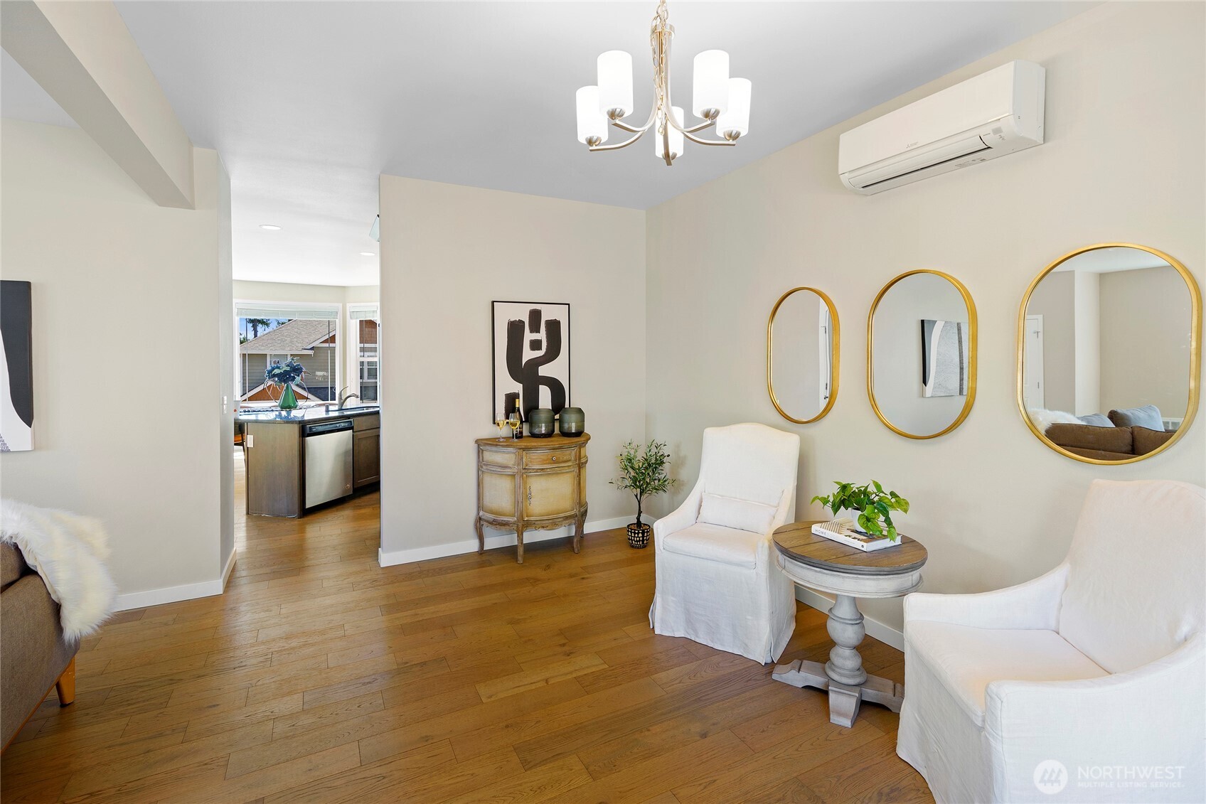 26442 GRAVITY Avenue Northeast Kingston, WA 98346 - Photo 13 of 40 a living room with kitchen island furniture and a chandelier