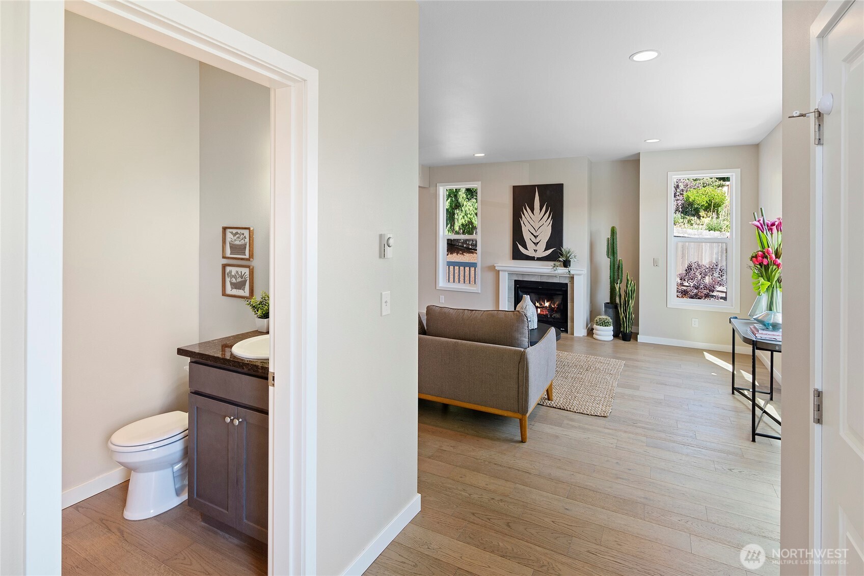 26442 GRAVITY Avenue Northeast Kingston, WA 98346 - Photo 15 of 40 a living room with furniture and a wooden floor