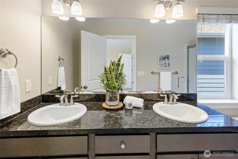 a bathroom with sinks granite granite and a sink