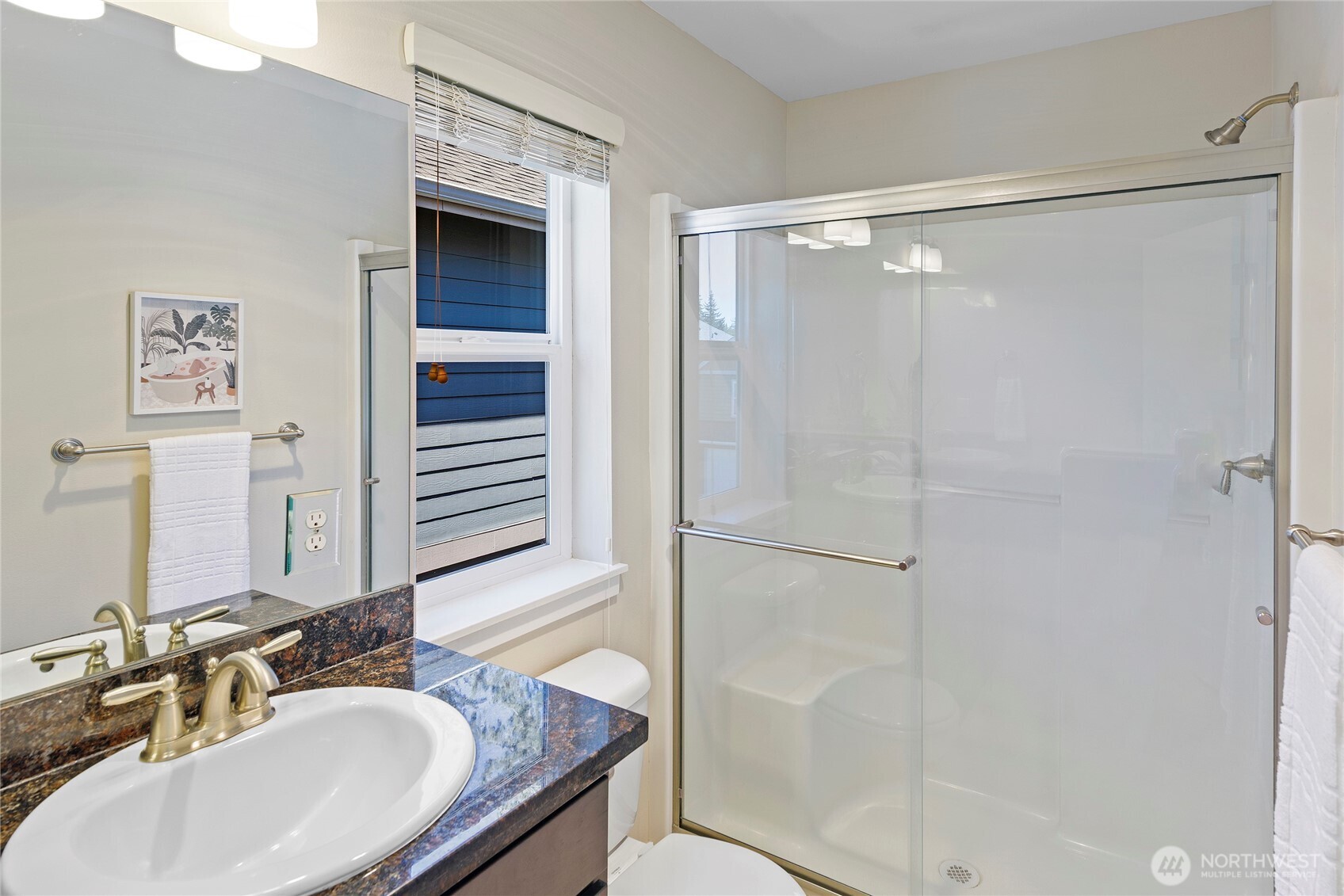 26442 GRAVITY Avenue Northeast Kingston, WA 98346 - Photo 22 of 40 a bathroom with a granite countertop shower sink and mirror