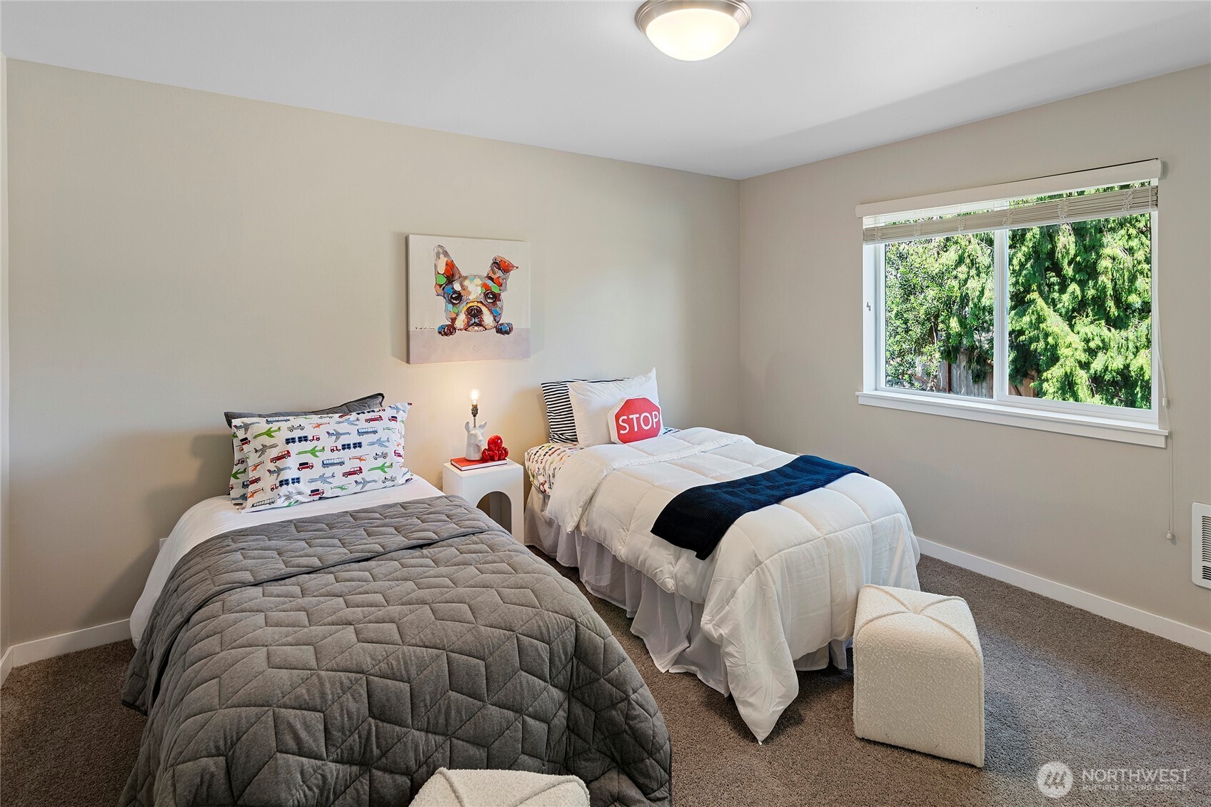 26442 GRAVITY Avenue Northeast Kingston, WA 98346 - Photo 25 of 40 a bedroom with two beds and a large window