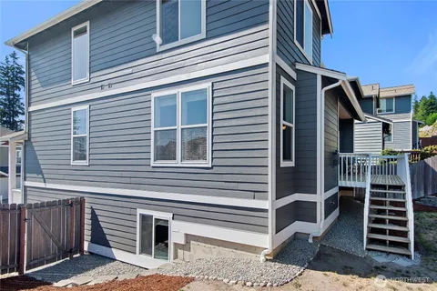 a front view of a house with stairs