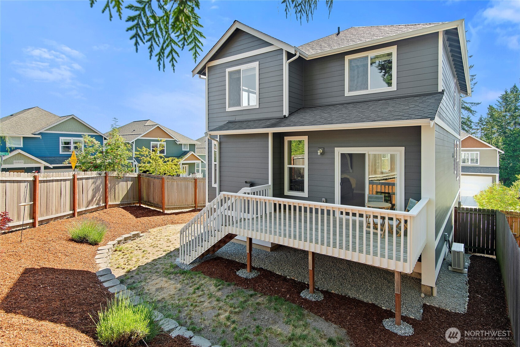 26442 GRAVITY Avenue Northeast Kingston, WA 98346 - Photo 31 of 40 a view of a house with a yard and deck