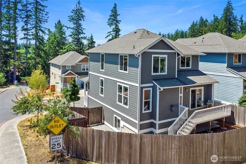 a aerial view of a house with a yard