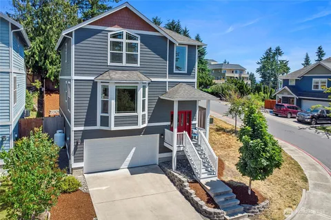 a front view of a house with a yard