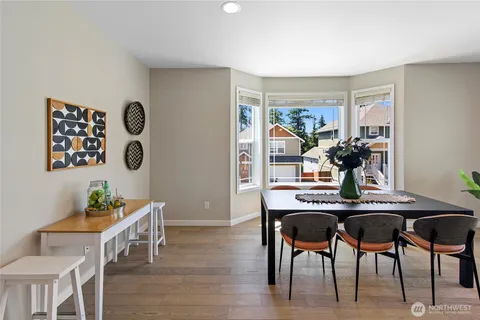 a view of a dining room with furniture and chandelier