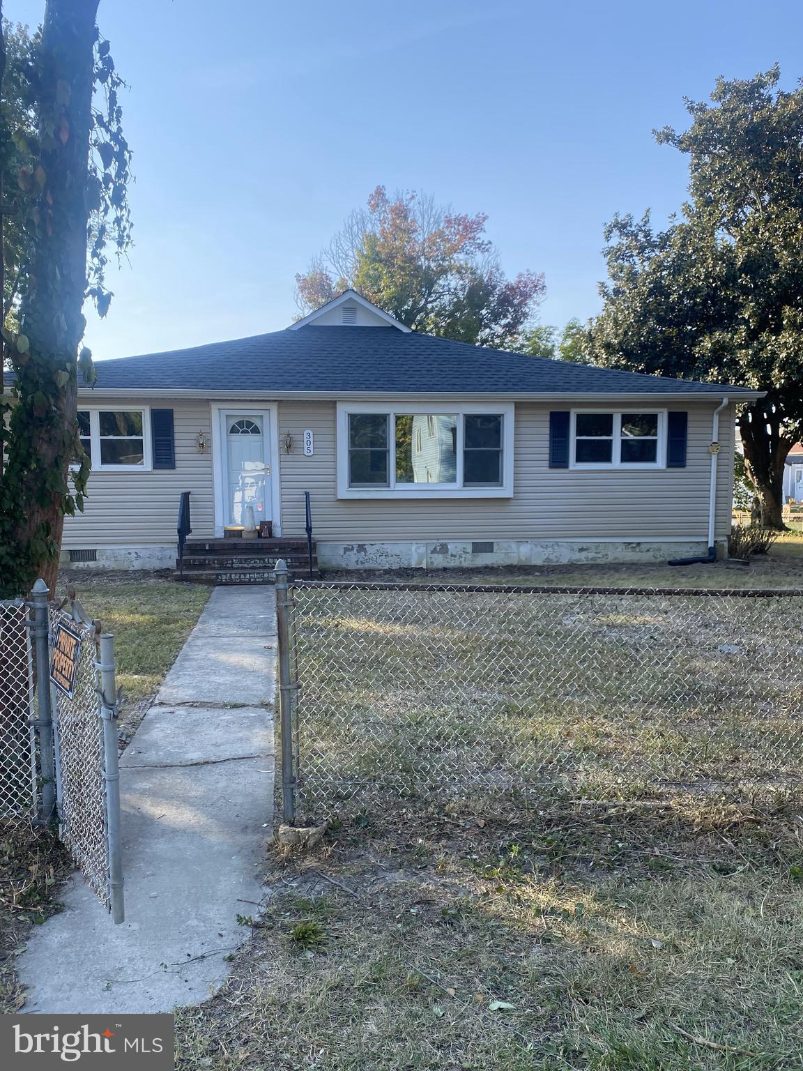 305 Maple Avenue Edgewater, MD 21037 - Photo 1 of 1 a view of a yard in front of a house with large tree