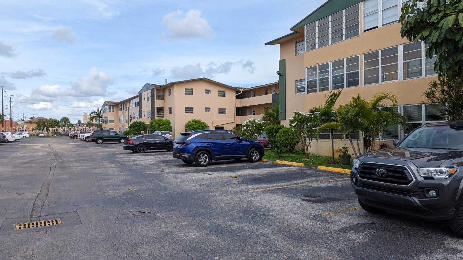 a view of a cars parked in front of a building