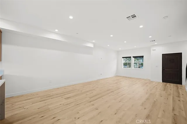 a storage room with a sink and washing machine