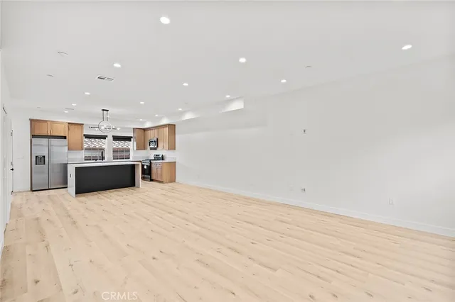 a view of kitchen and kitchen with a sink