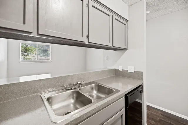 a view white cabinets and a sink
