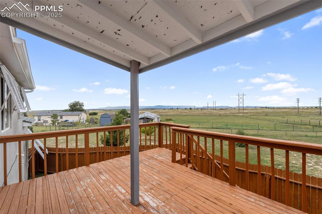 18895 Sage Crest Road Peyton, CO 80831 - Photo 34 of 38 a view of balcony with wooden floor
