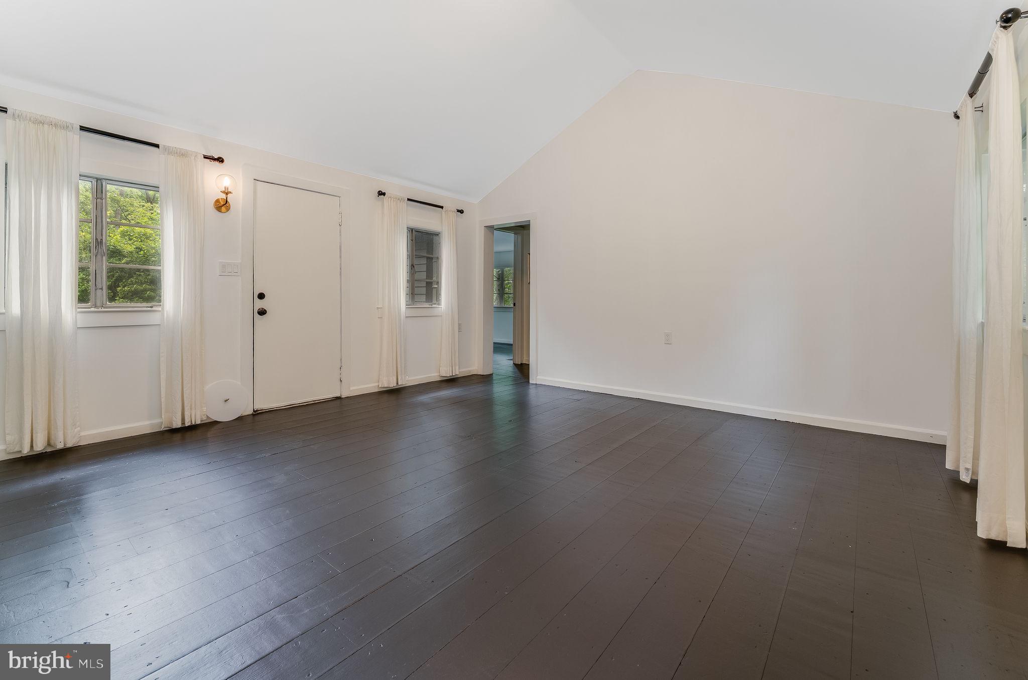 592 Province Line Road Hopewell, NJ 08525 - Photo 29 of 70 an empty room with wooden floor and windows