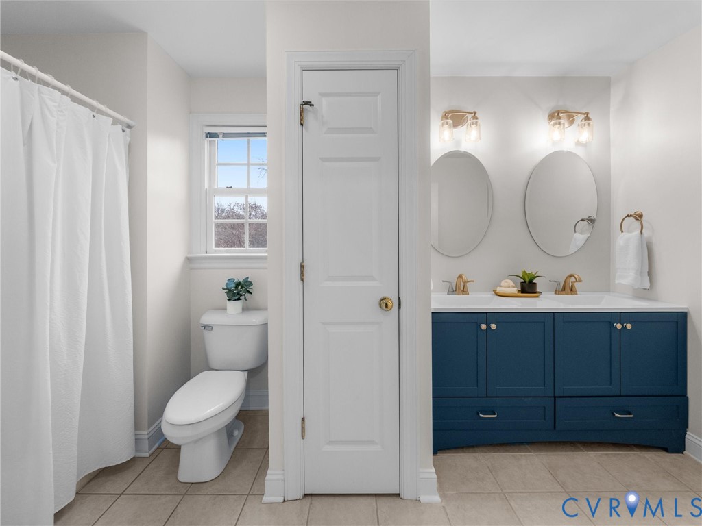 14335 Lander Road Midlothian, VA 23113 - Photo 47 of 70 a bathroom with a toilet a sink and mirror