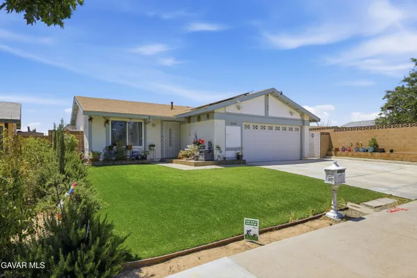 a view of a back yard of the house