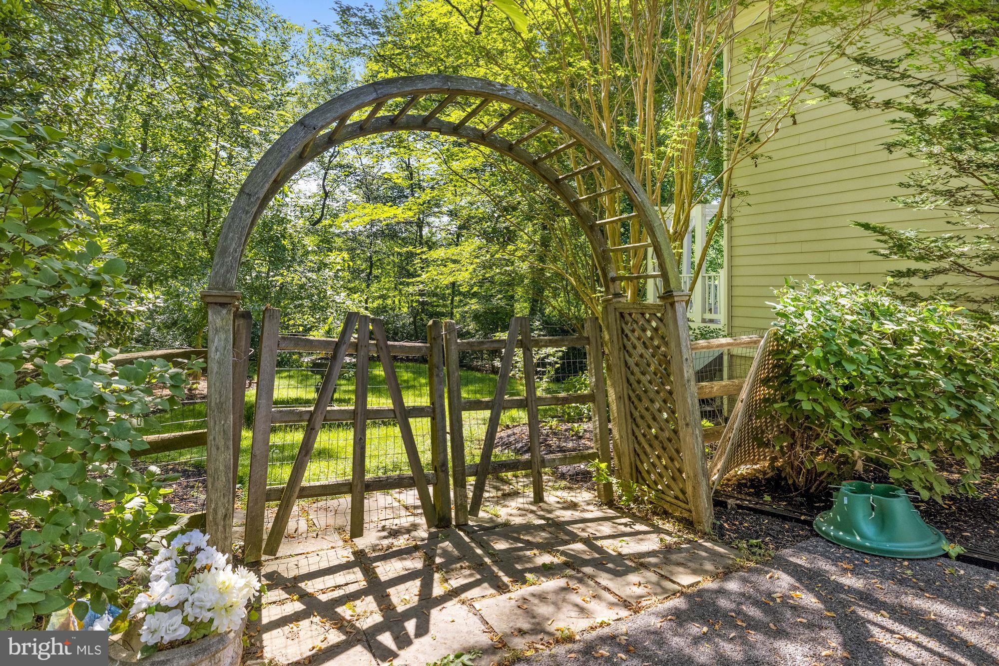 9448 Seven Locks Road Bethesda, MD 20817 - Photo 39 of 46 Lovely gardens, arbor and gate lead to back yard