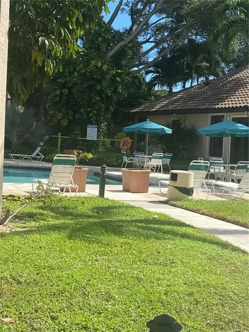 a view of a swimming pool with a patio