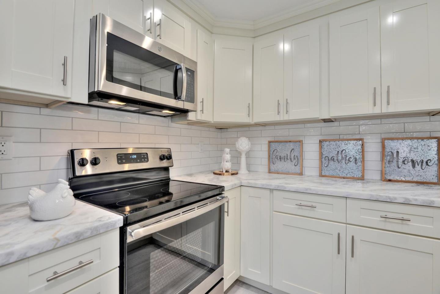 301 Kenbrook Circle San Jose, CA 95111 - Photo 8 of 19 a kitchen with appliances cabinets and a sink