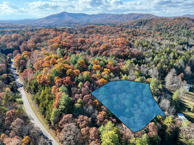 an aerial view of multiple house with yard