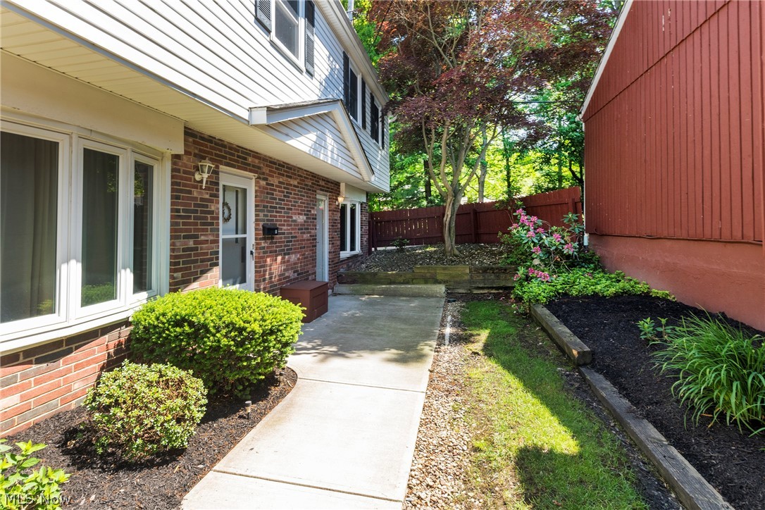 6484 State Road Parma, OH 44134 - Photo 4 of 36 Landscaped walkway leading to the private front entrance.
