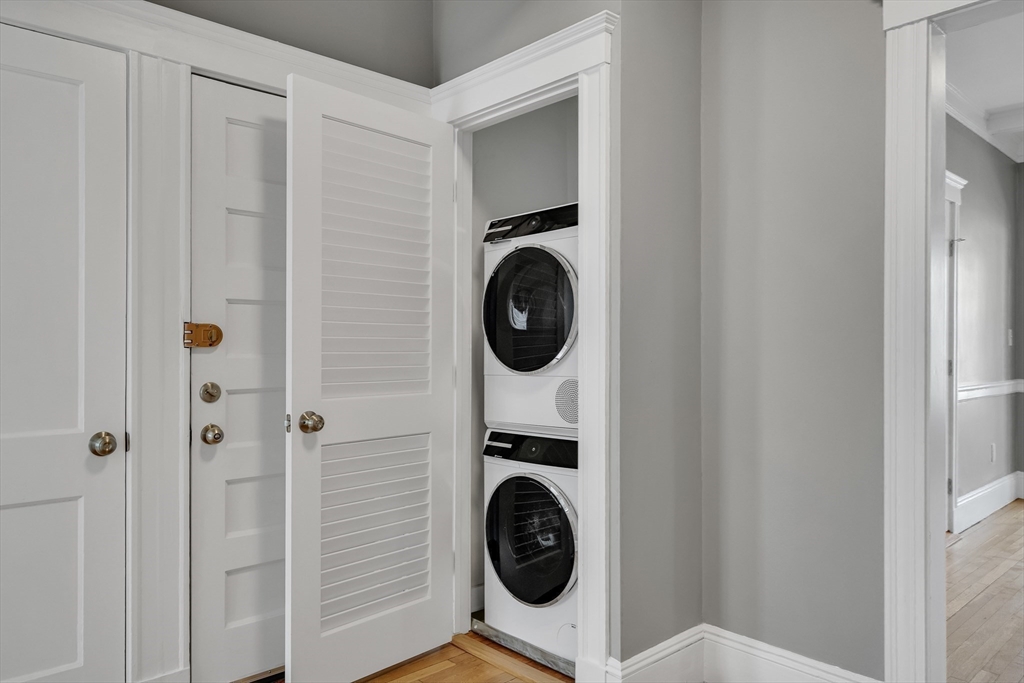142 Sutherland Road, Unit 1 Boston, MA 02135 - Photo 12 of 16 a utility room with dryer and washer
