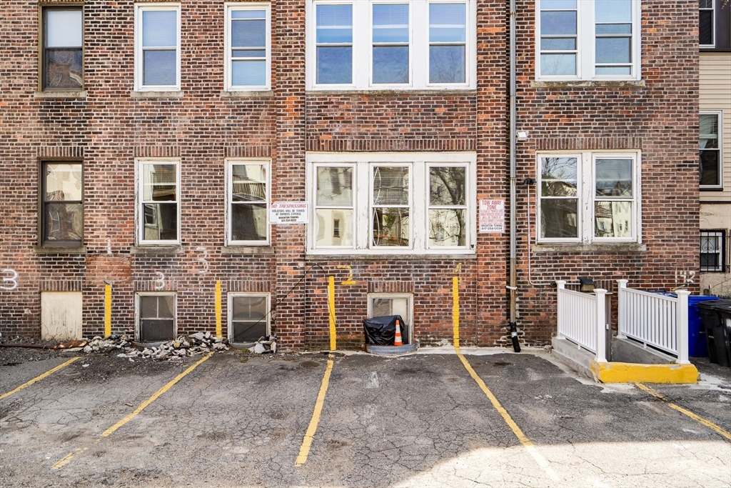 142 Sutherland Road, Unit 1 Boston, MA 02135 - Photo 16 of 16 front view of a brick building