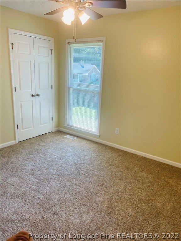 6501 Applewhite Road Fayetteville, NC 28304 - Photo 12 of 17 an empty room with an entryway