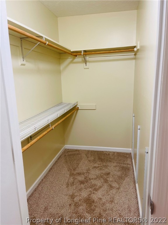 6501 Applewhite Road Fayetteville, NC 28304 - Photo 15 of 17 a view of a room with racks on the wall