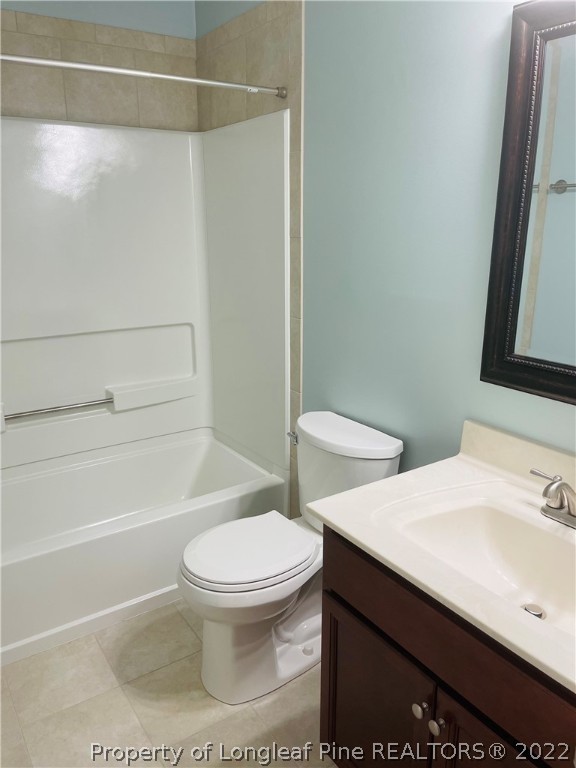 6501 Applewhite Road Fayetteville, NC 28304 - Photo 16 of 17 a bathroom with a sink a toilet and shower