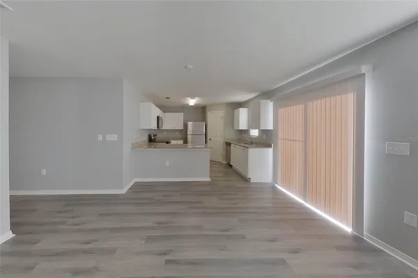 a view of kitchen with wooden floor