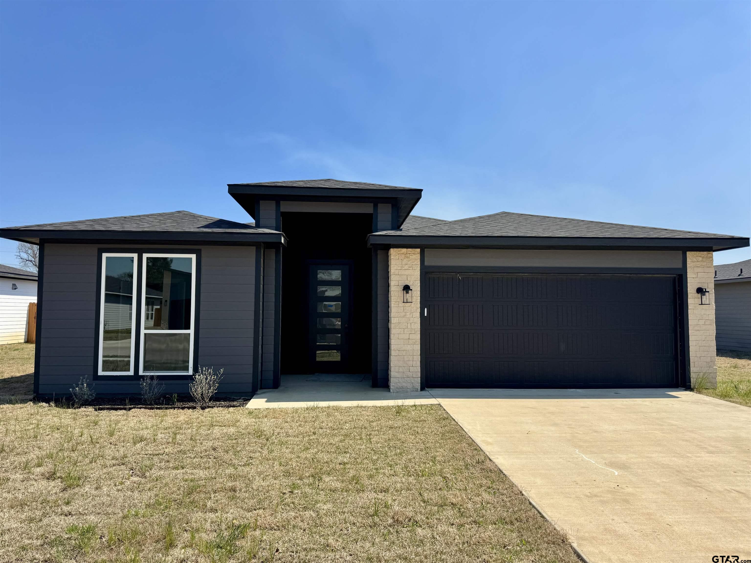 15525 Greenhouse Way Lindale, TX 75771 - Photo 1 of 7 a front view of a house