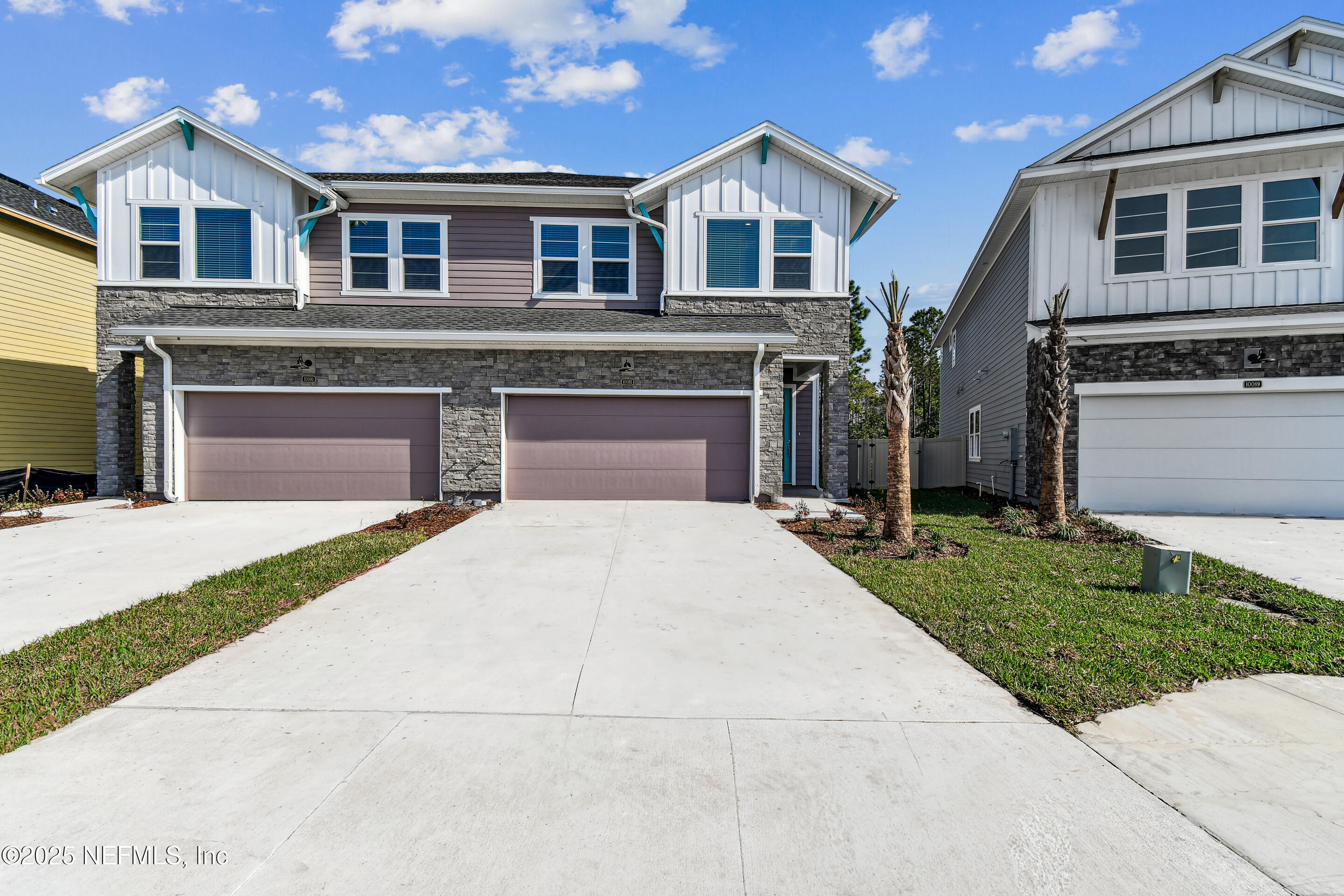 10085 Element Road Jacksonville, FL 32256 - Photo 1 of 24 a front view of a house with a yard and garage
