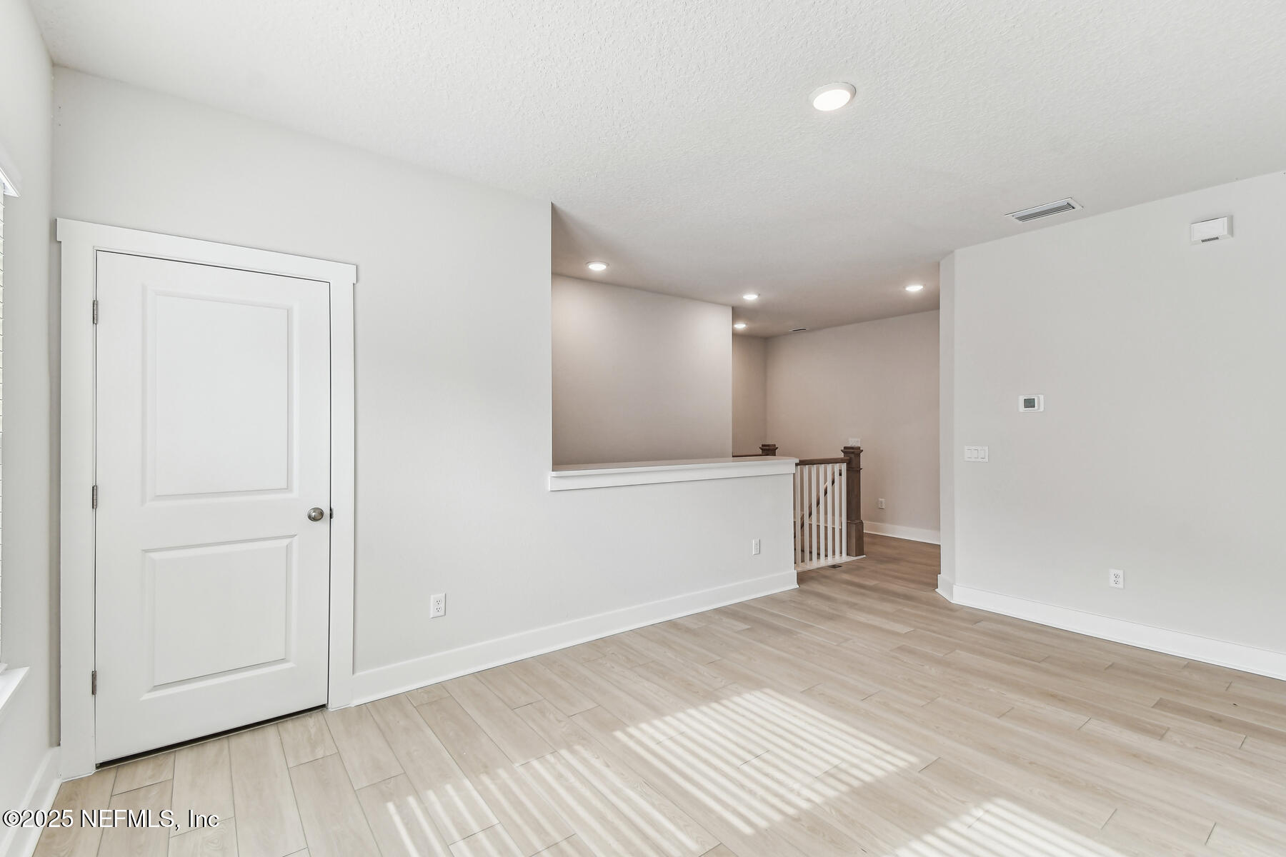 10085 Element Road Jacksonville, FL 32256 - Photo 15 of 24 wooden floor in an empty room with wooden floor