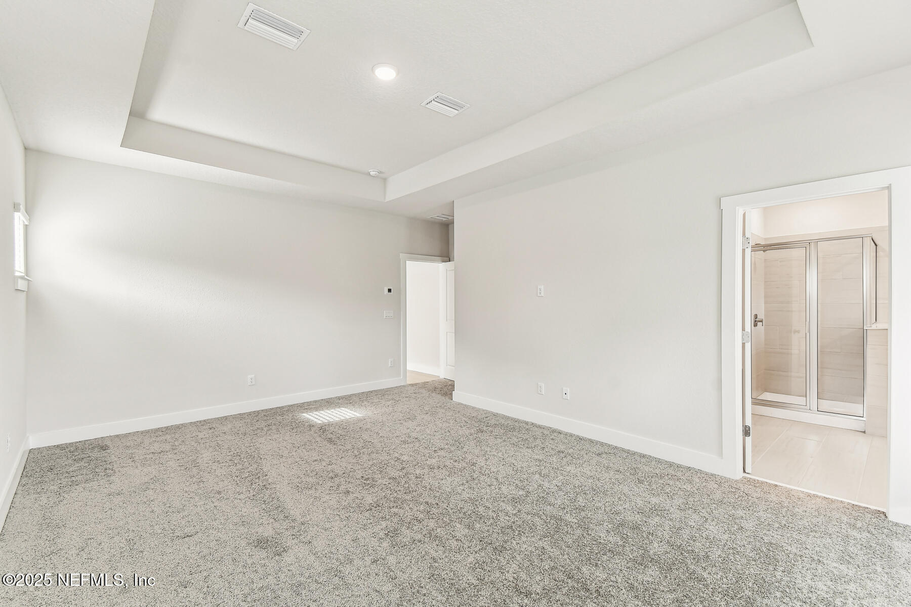 10085 Element Road Jacksonville, FL 32256 - Photo 18 of 24 an empty room with a natural light