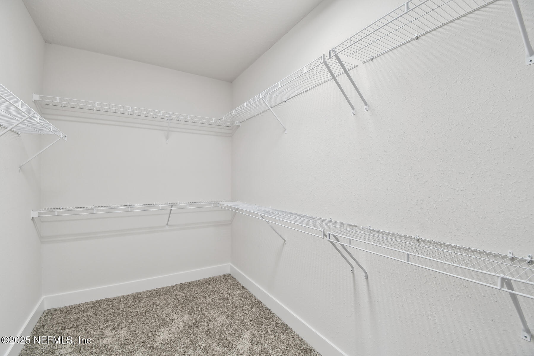 10085 Element Road Jacksonville, FL 32256 - Photo 21 of 24 a view of a room with empty racks