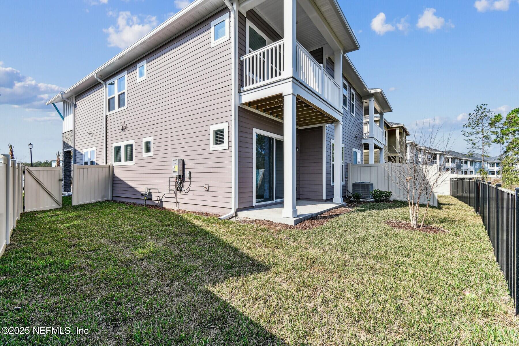 10085 Element Road Jacksonville, FL 32256 - Photo 23 of 24 a house view with a backyard space
