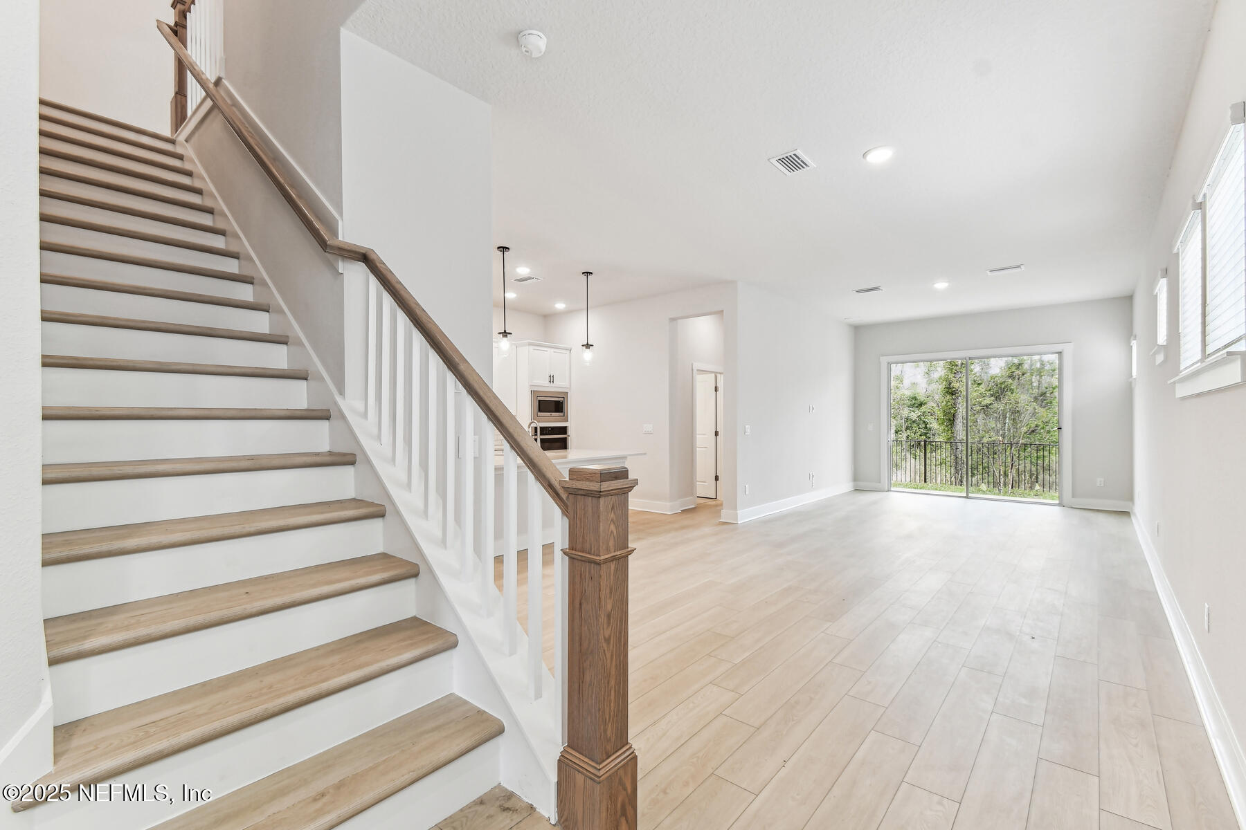 10085 Element Road Jacksonville, FL 32256 - Photo 10 of 24 a view of entryway and hall with wooden floor