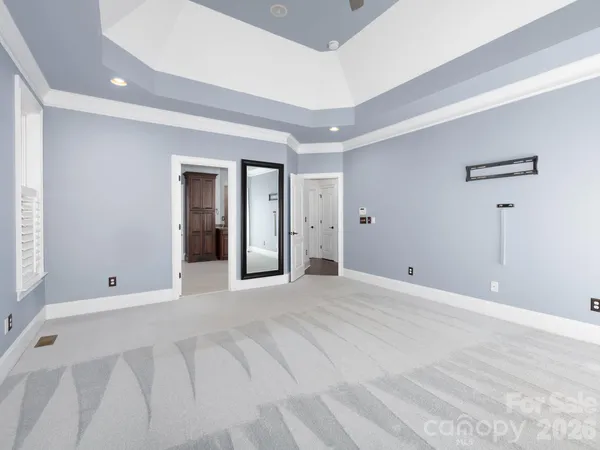 a kitchen with granite countertop white cabinets and a sink