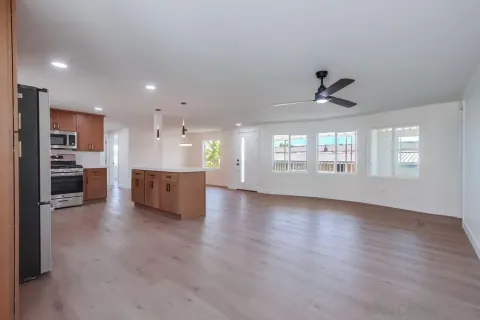 a view of a kitchen with a sink and a window