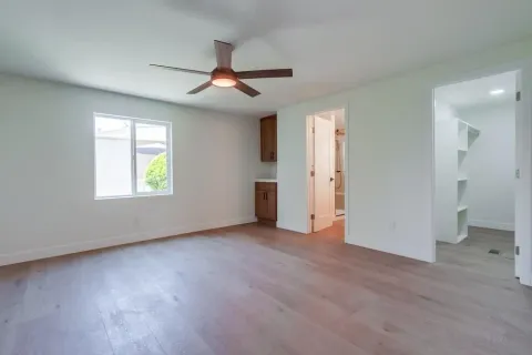 a view of an empty room with a window