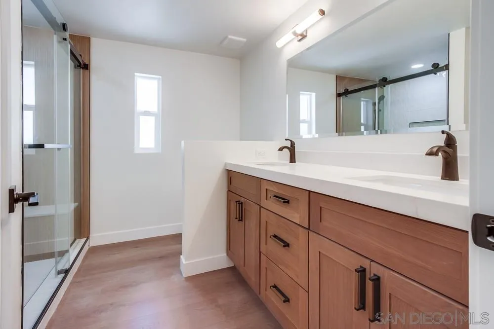650 South Rancho Santa Fe Road, Unit 328 San Marcos, CA 92078 - Photo 18 of 22 a spacious bathroom with a tub sink and mirror