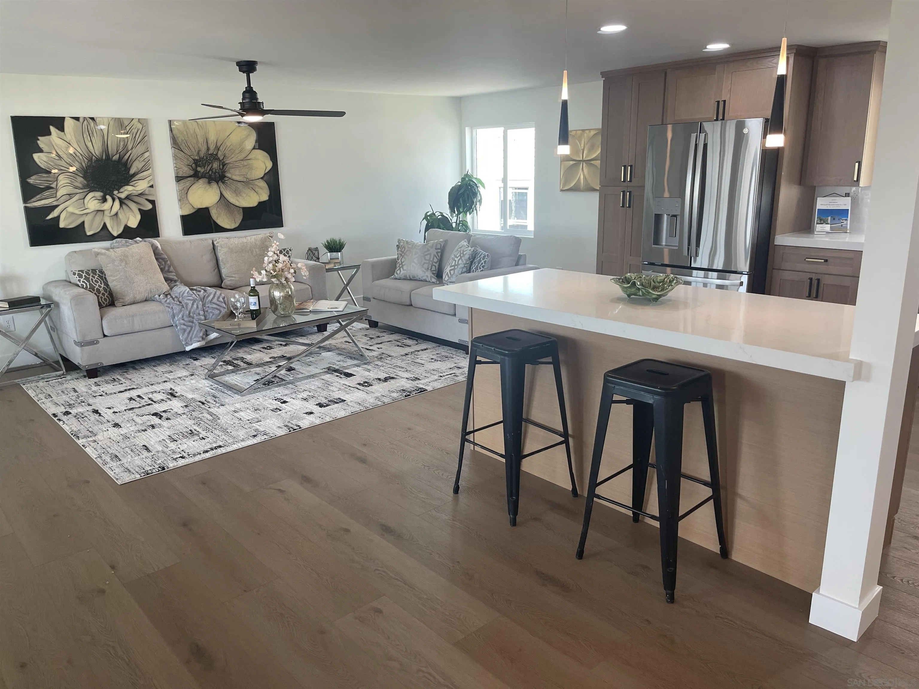 650 South Rancho Santa Fe Road, Unit 328 San Marcos, CA 92078 - Photo 5 of 22 a living room with furniture and wooden floor