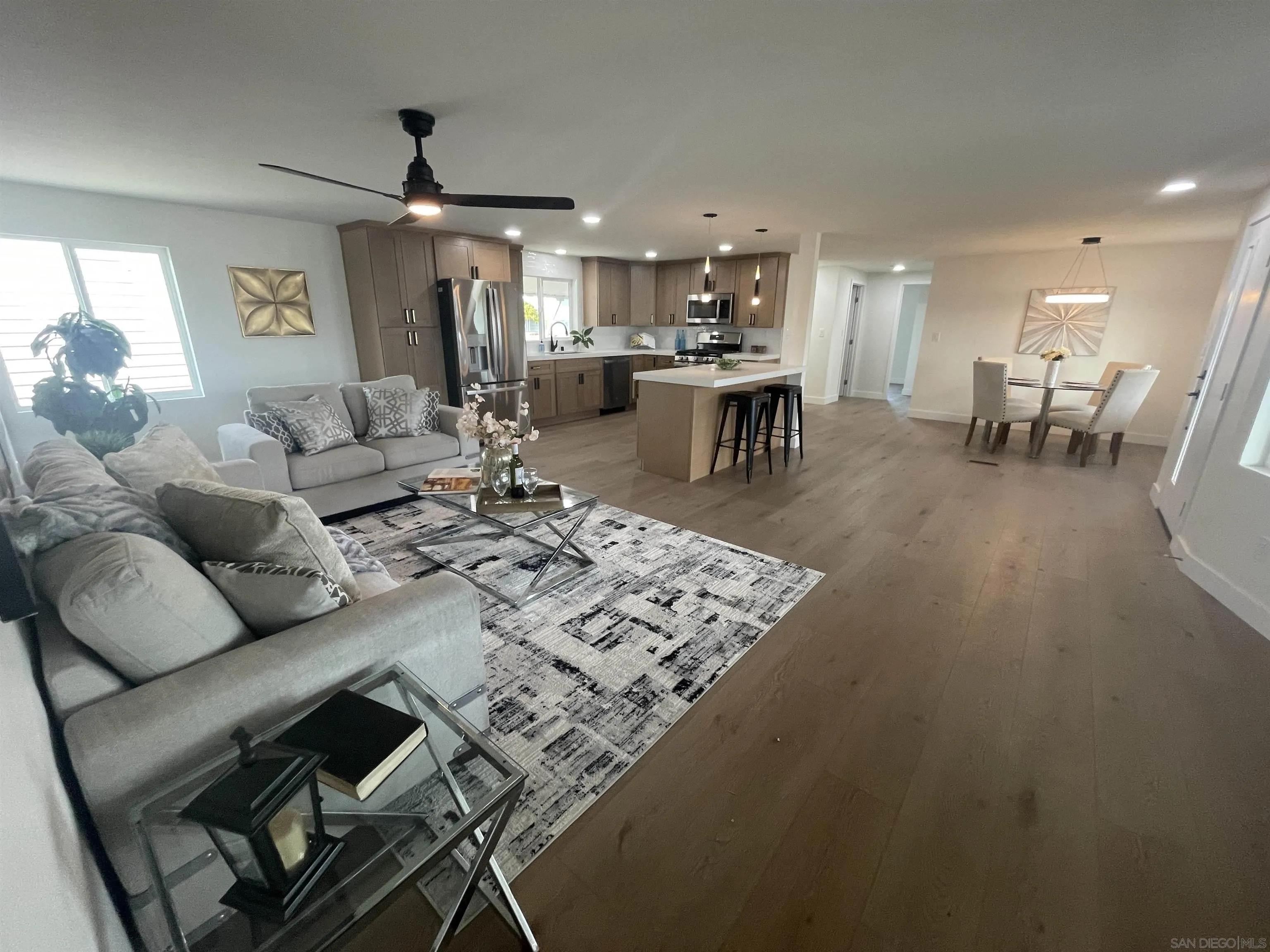 650 South Rancho Santa Fe Road, Unit 328 San Marcos, CA 92078 - Photo 6 of 22 a living room with furniture and kitchen view